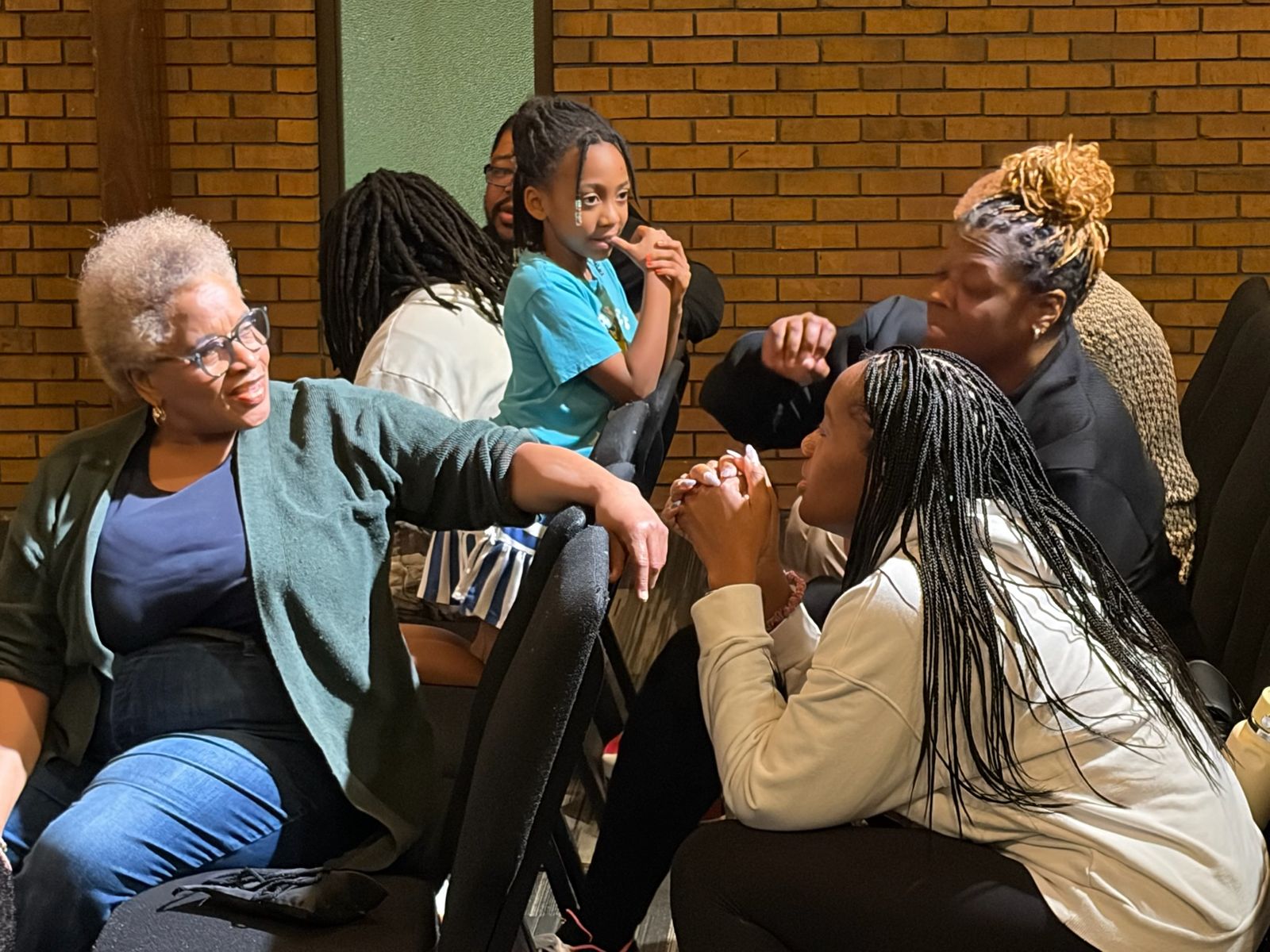Members talking and laughing together after service